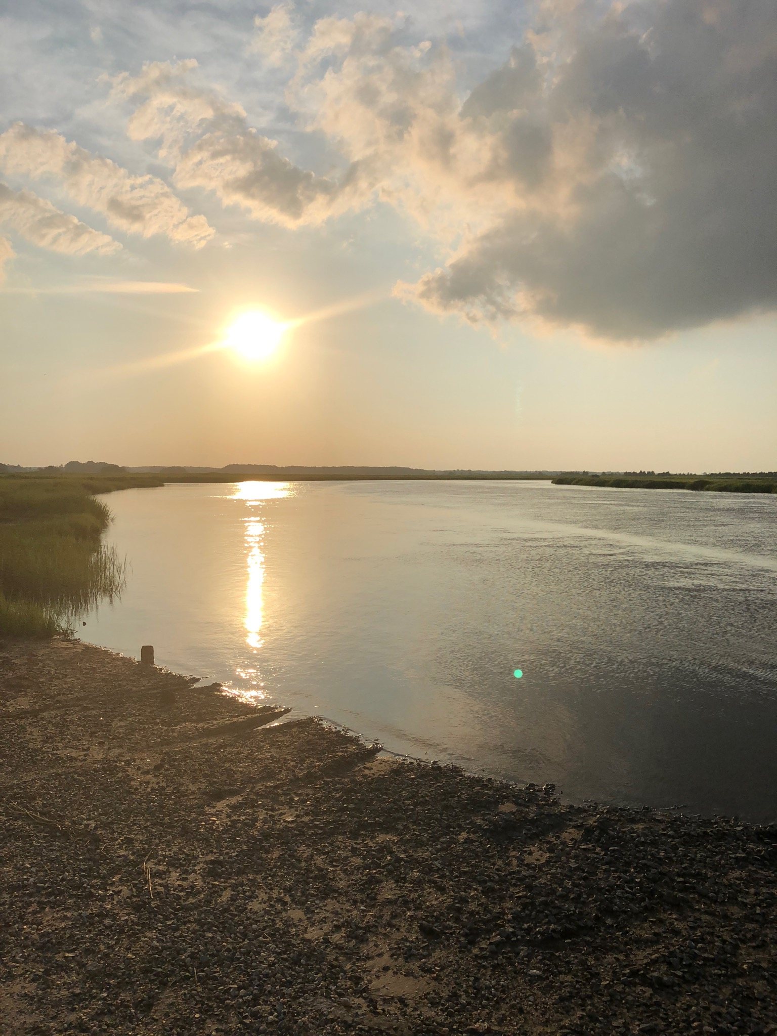 Sunset over marshland and water